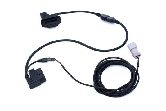 A durable, high-quality unlock cable, showcasing its connectors, set against a backdrop of the Nissan Titan, highlighting its compatibility and the promise of enhanced performance.