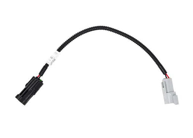 A sleek, durable cable with connectors on both ends, designed to seamlessly integrate with the 2015-2019 5.0L Nissan Titan and the Ez Lynk Platform.