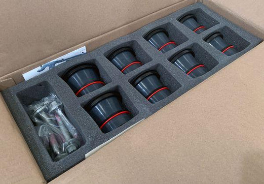 The image showcases S&B Filters' Premium Body Mount Kit, featuring eight robust, blue silicone rubber mounts. Each mount, four upper and four lower, is meticulously designed with high durometer and resilience against extreme temperatures and contamination. The neatly arranged components reflect the ease of installation. For 1999-2003 Ford Crew Cab owners, this image testifies to the superior quality and enhanced stability consistently provided by S&B Filters' products.